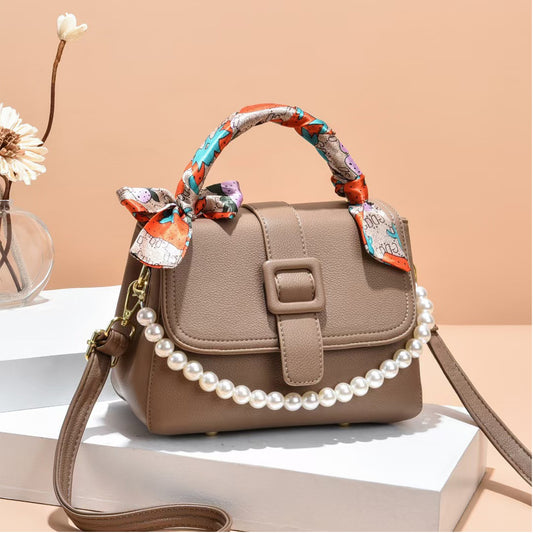 Beige casual sling bag with scarf design and pearl handle