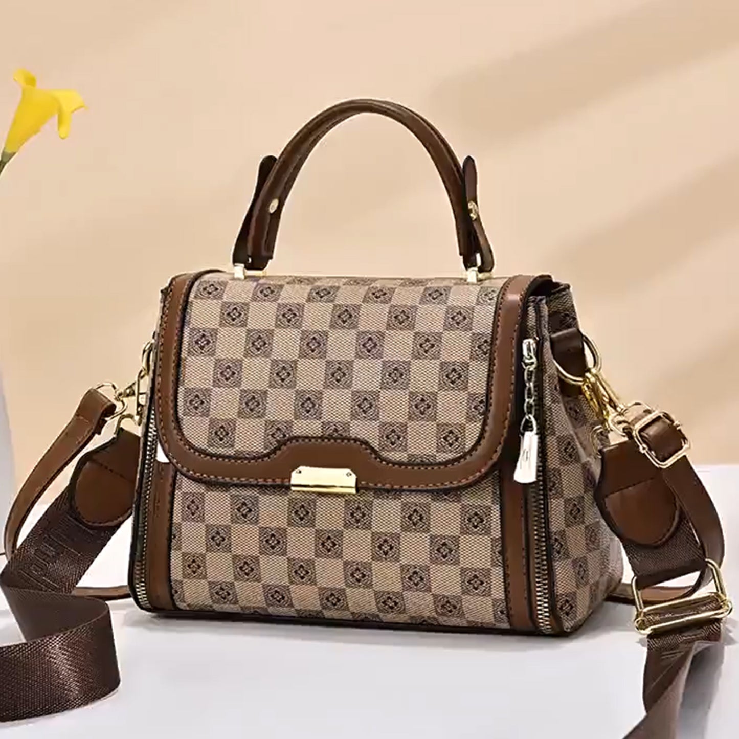Tan brown structured PU sling bag with a checkered pattern, dual handles, and a detachable shoulder strap, offering a stylish and comfortable design for everyday use.