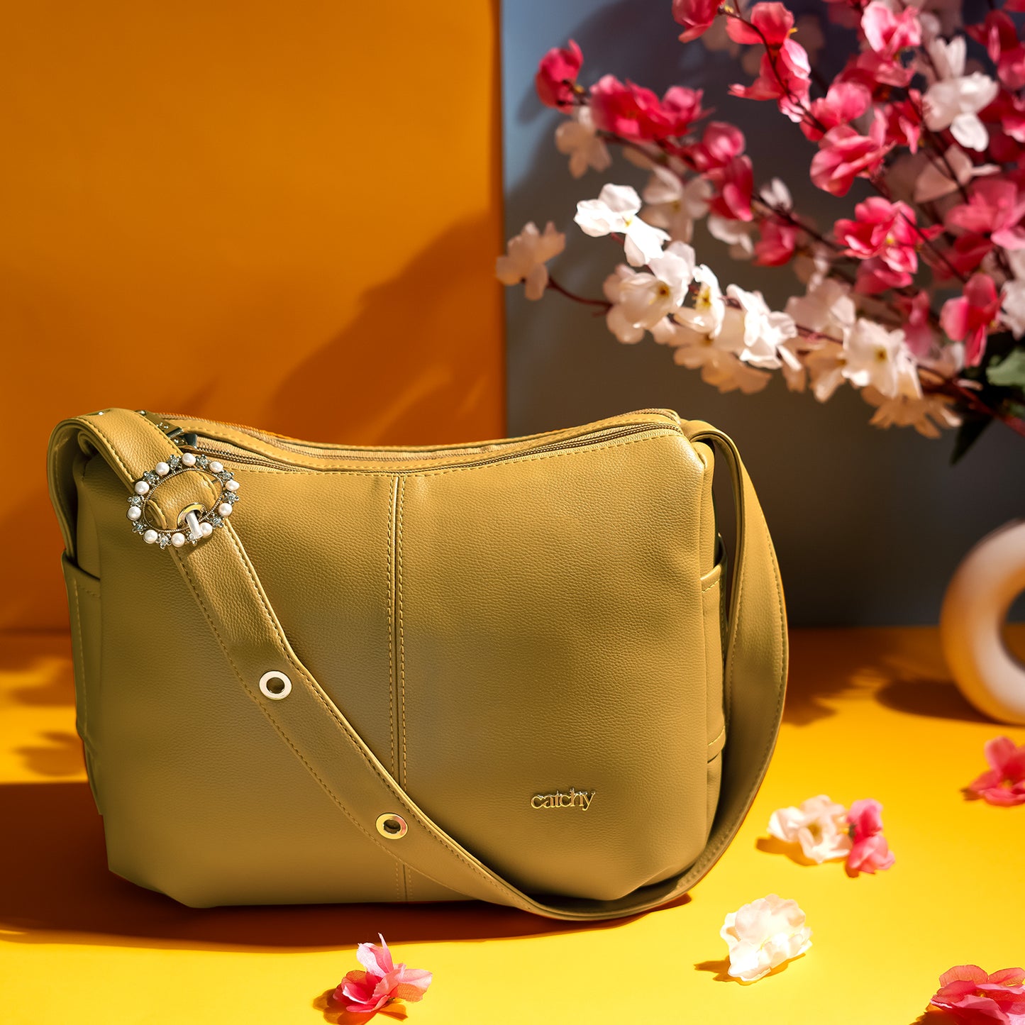 Premium yellow handbag with decorative buckle, medium-sized and spacious for everyday elegance