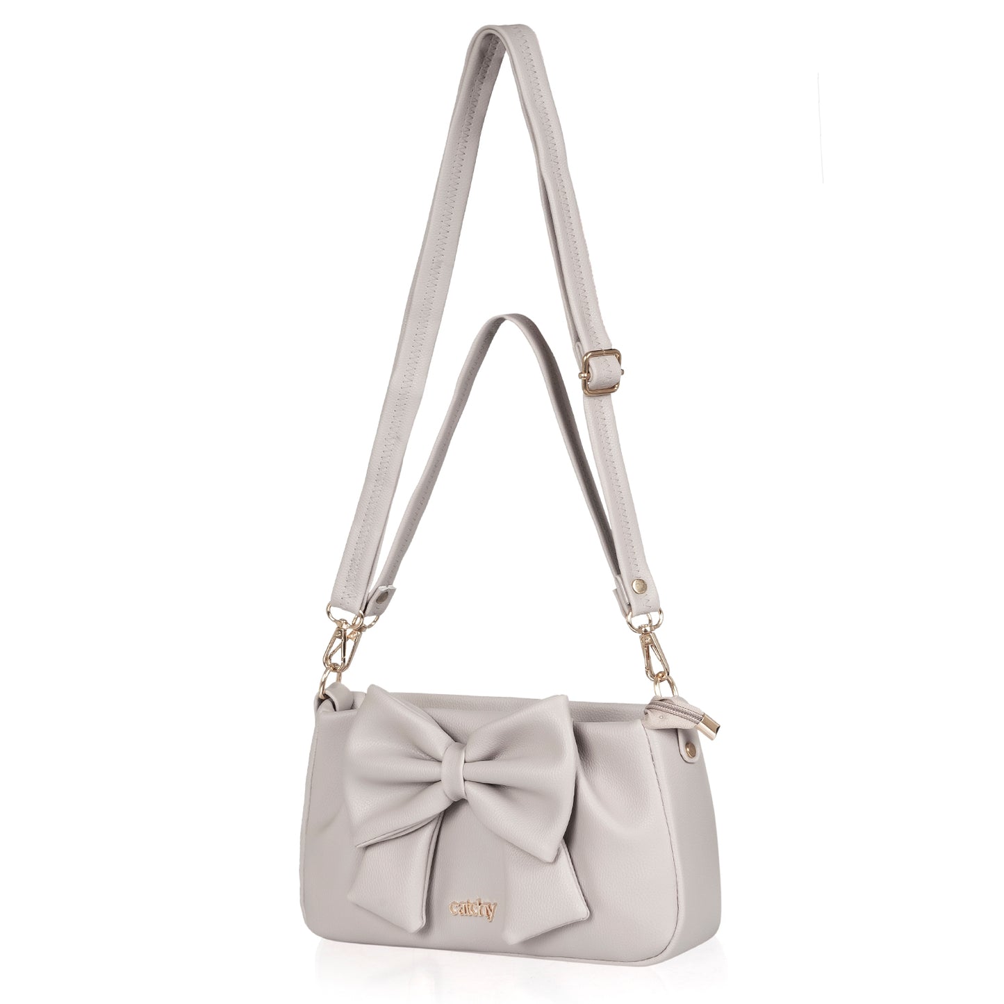 Brown bow handbag styled on a desk for a professional, chic aesthetic.