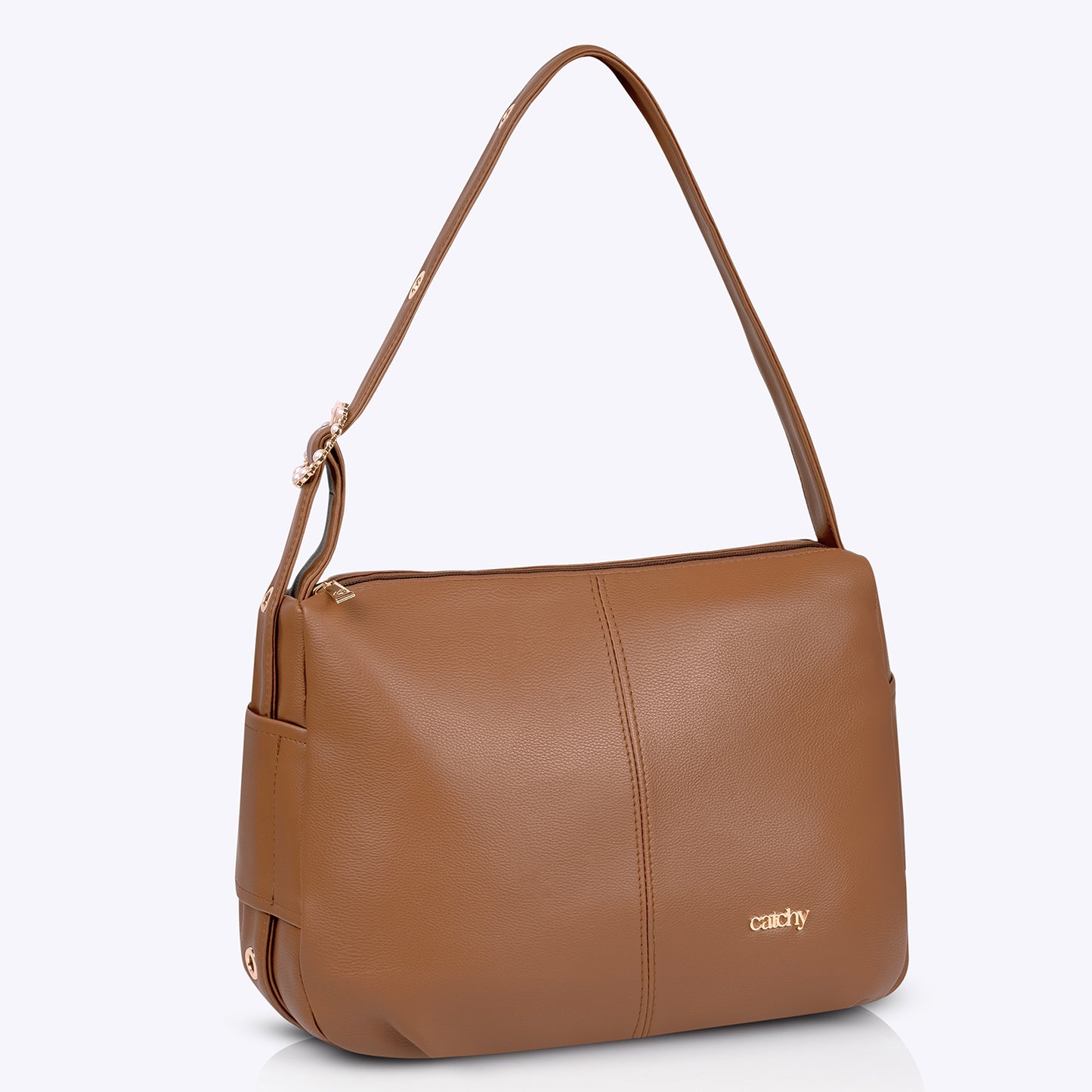 Premium tan coloured handbag with gold hardware, a spacious medium-sized shoulder bag featuring a long strap for everyday elegance.