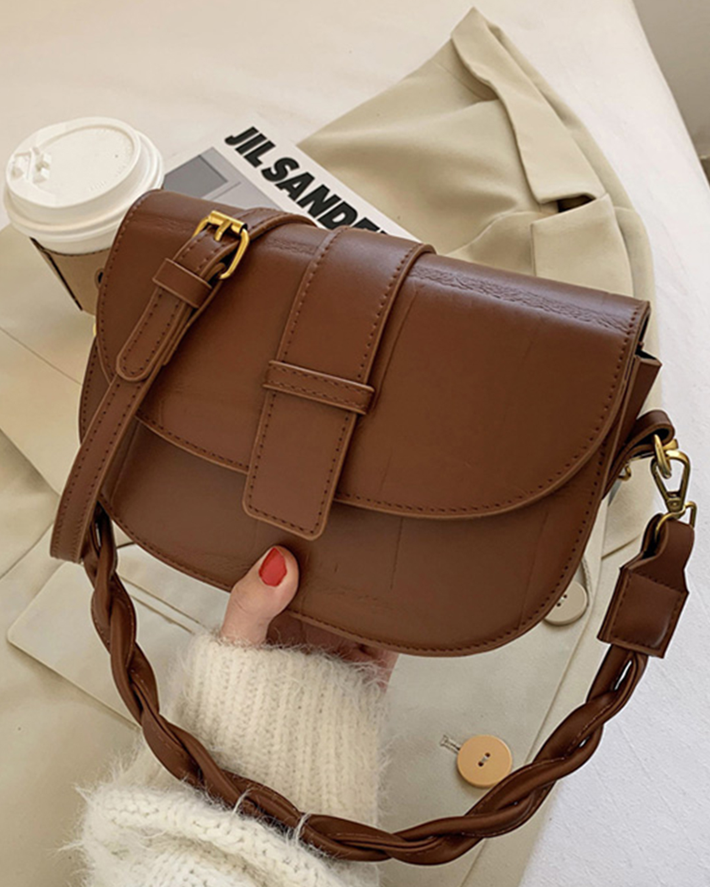 Half moon sling bag styled with denim for casual cool look