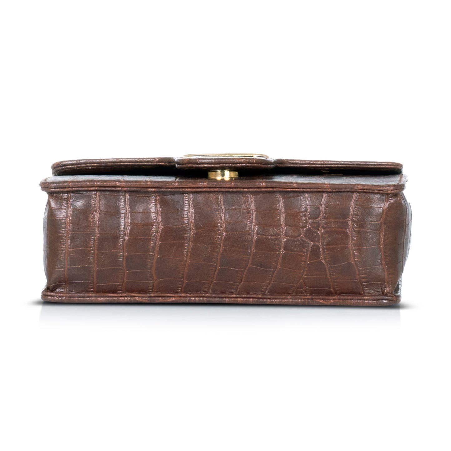 Black croc-textured purse styled with a winter coat, showcasing its all-season versatility.