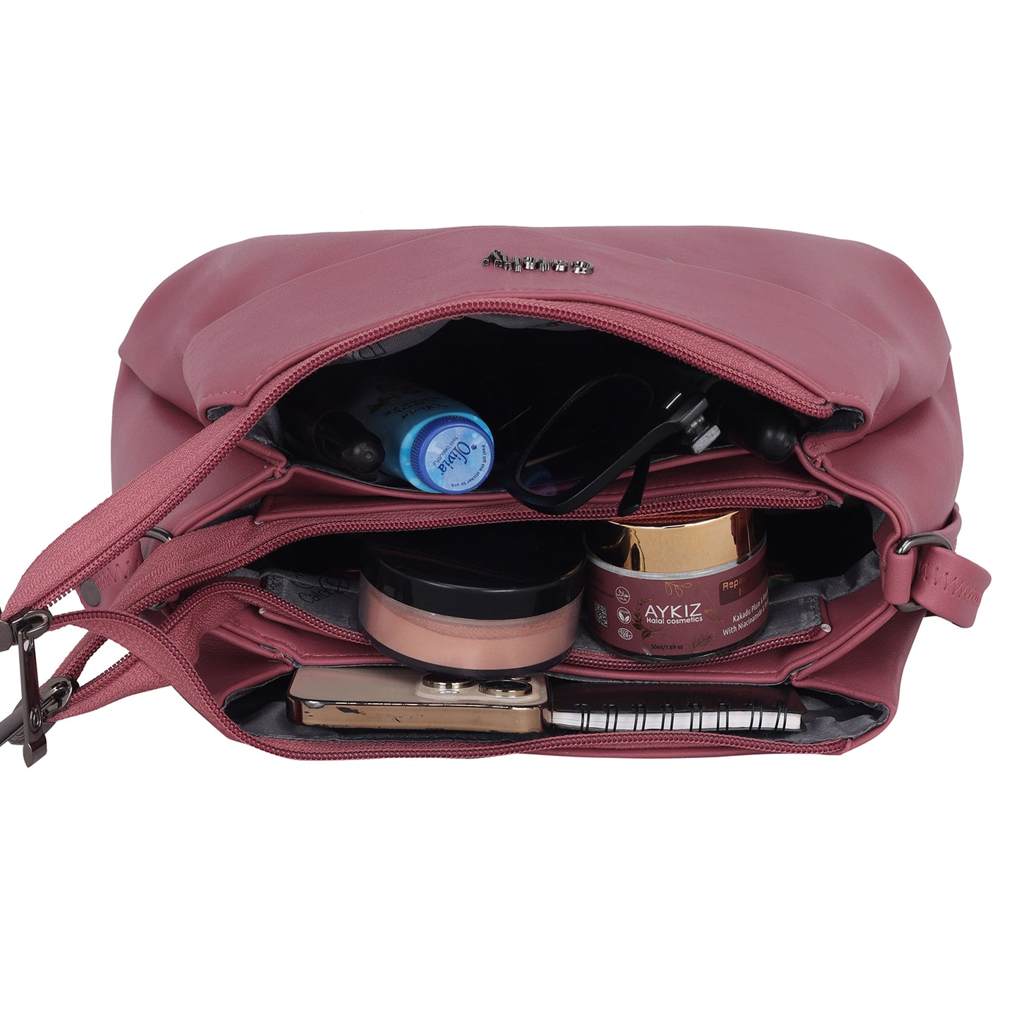 Women shoulder sling bag in patterned fabric for unique look.