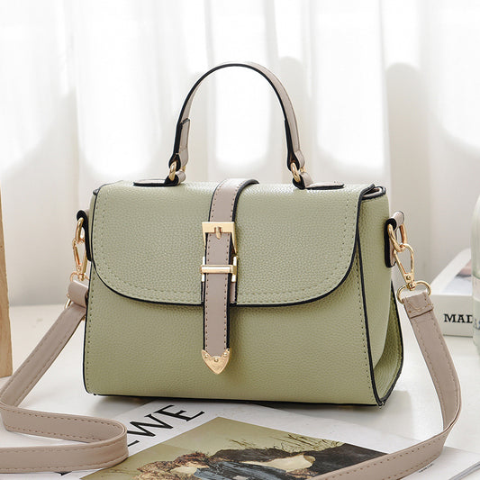 Stylish pista green and beige sling bag for women, perfect for casual outings.