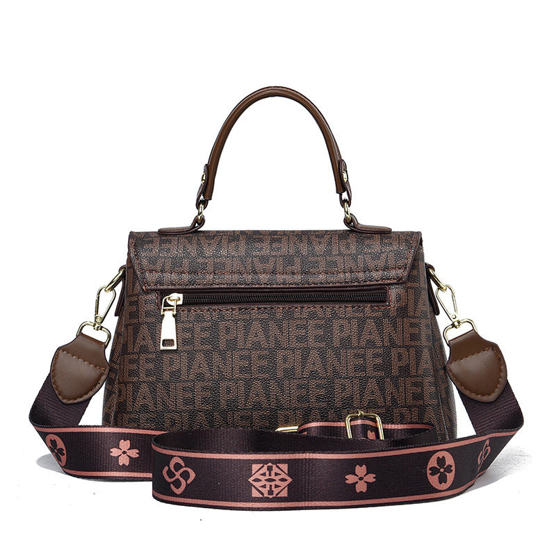 Sling bag leather brown with magnet closure, crafted for style.