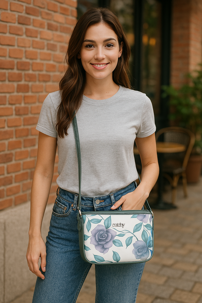 Elegant green floral sling bag with detachable handle for versatile carrying.