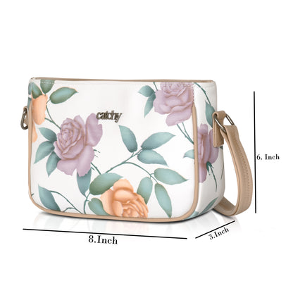 Eye-catching green sling bag with floral print and sturdy metal zipper.