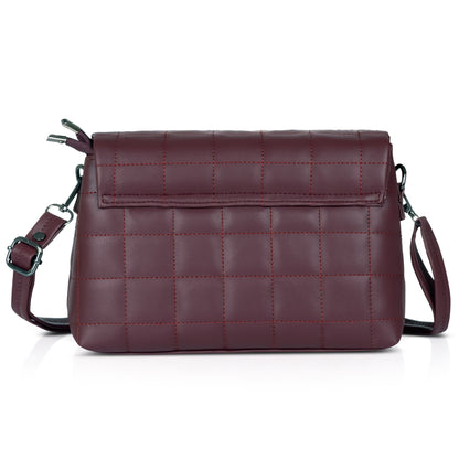 Black quilted shoulder bag with gold hardware, ideal for sophisticated outfits.