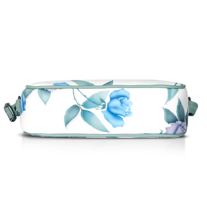 Fashionable green floral sling bag with durable strap and modern design.
