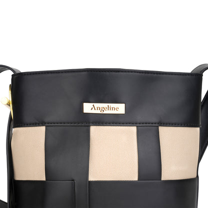 Close-up of Angeline logo in gold on black and beige canvas tote bag.