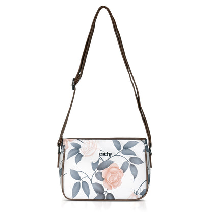 Green floral sling bag with durable materials for long-lasting use.