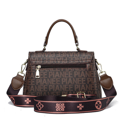 Sling bag leather brown with magnet closure, crafted for style.